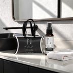 Nelaj Sky skincare products on a bathroom counter with a mirror in the background